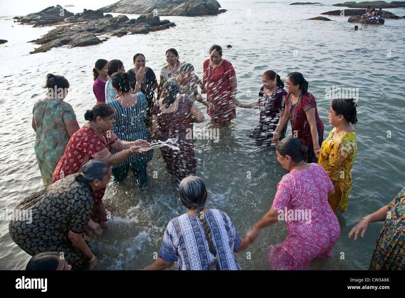Hindu women bathing in the sea. Kanyakumari. Cape Comorin. India Stock Photo