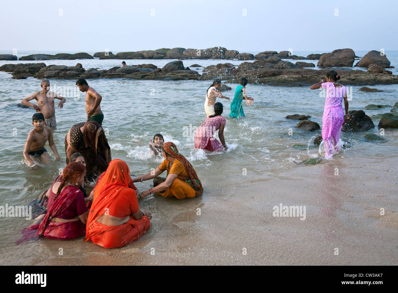 Indian women bathing in the sea. Kanyakumari. Cape Comorin. India Stock Photo