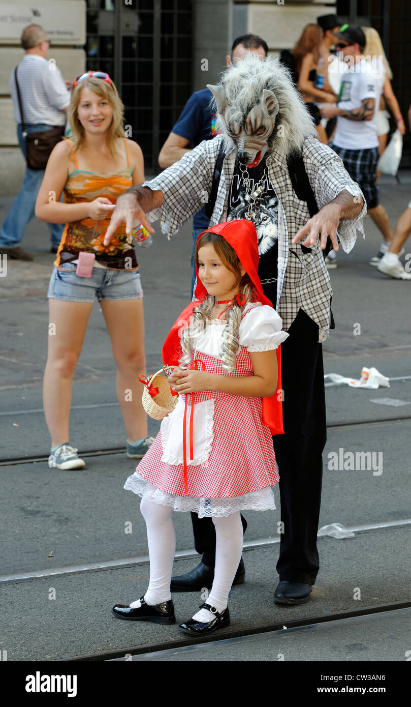 Red riding hood and the wolf - Revelers at the Zurich Street Parade, a techno and trance festival. Stock Photo