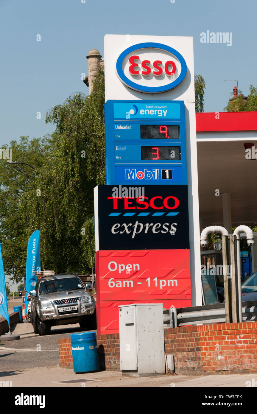 An Esso petrol station with Tesco Express on a busy main road. Stock Photo