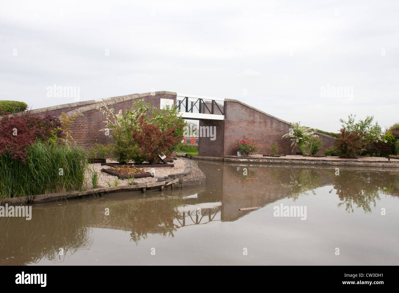 Ashby Canal Centre in Stoke Golding is photographed from the moving narrow boat Stock Photo