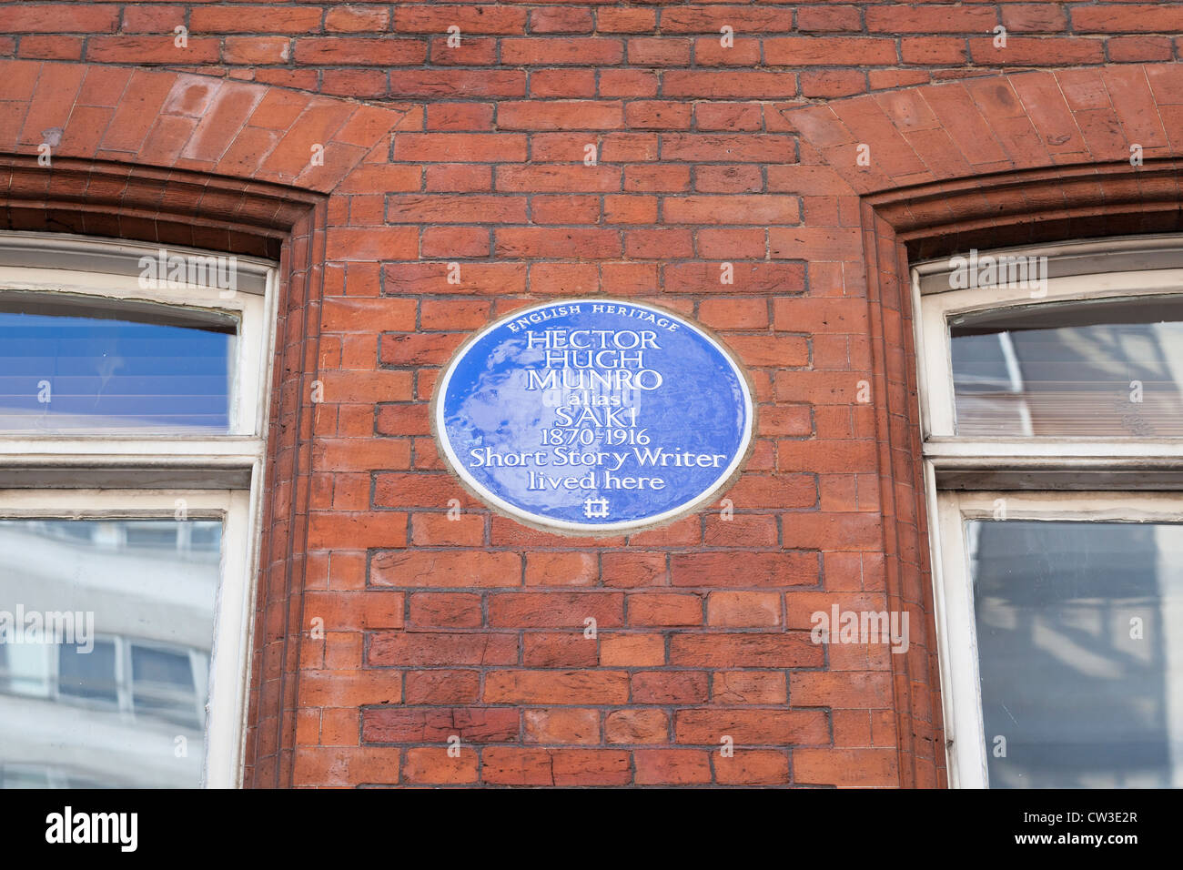 Blue plaque marking the home of Hector Hugh Munro, London, England Stock Photo