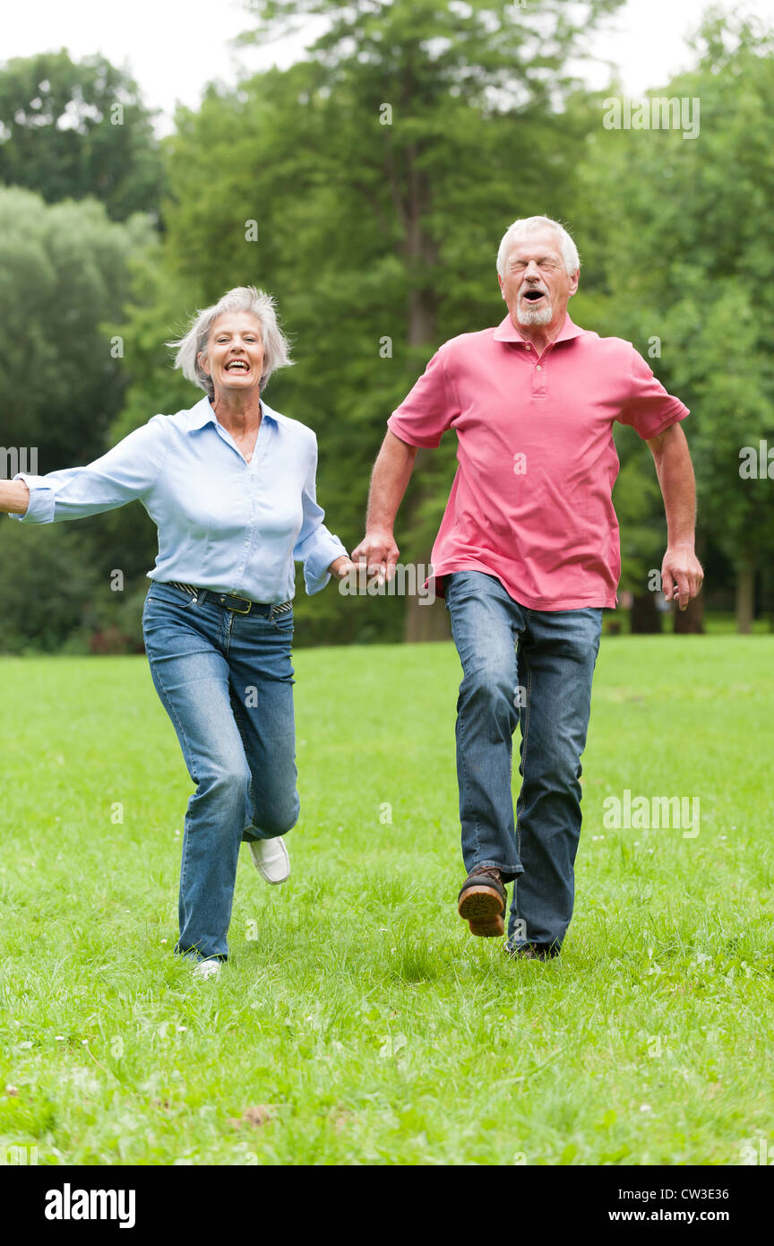 Active senior couple in the park Stock Photo - Alamy