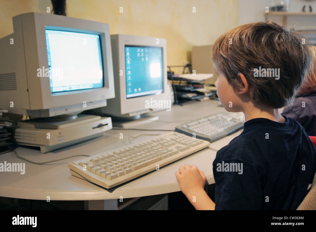Berlin, a child sitting in front of a computer Stock Photo - Alamy