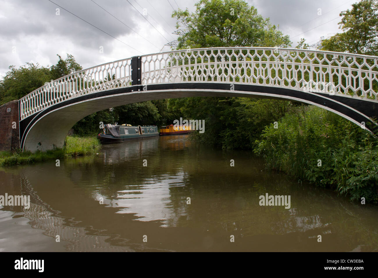 Oxford canal bridge 53 near Rugby, Warwickshire, England. Beyond the bridge is Willow Wren UK Boat hire. Stock Photo