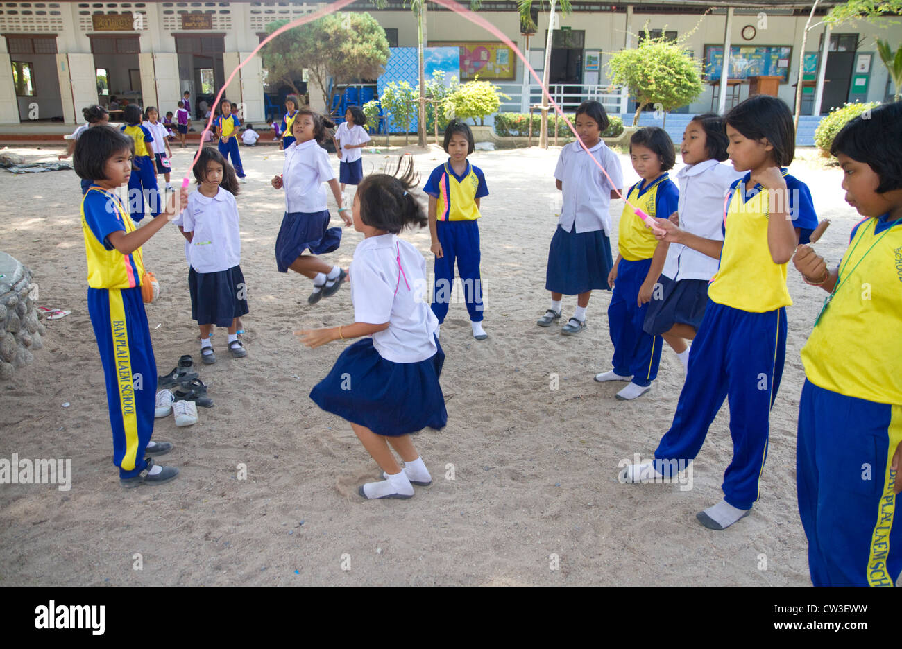Thai elementary school students jump rope on the island of Ko Samui, Thailand. Stock Photo