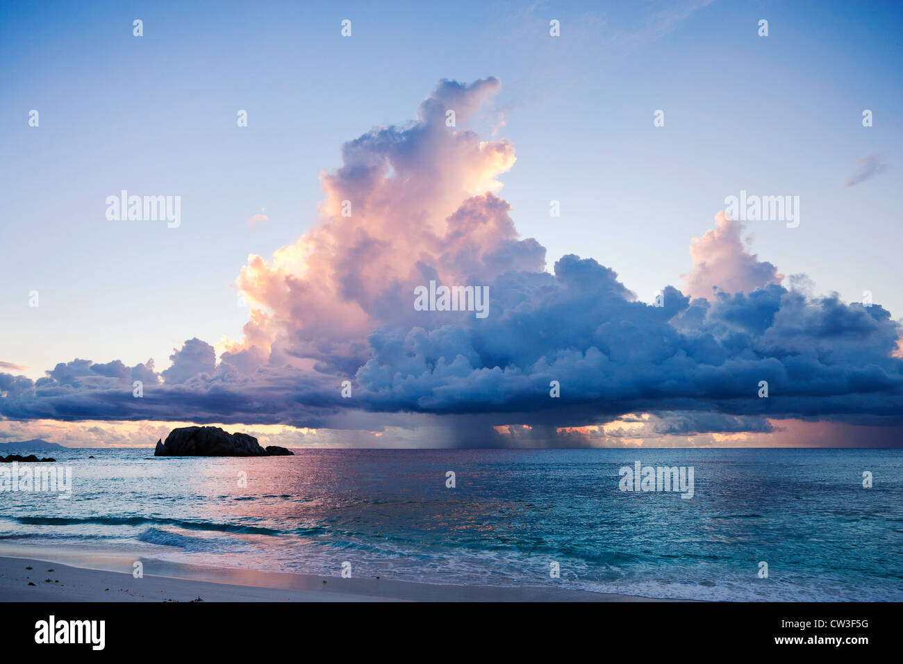 Storm clouds at sunset over the ocean. Seychelles. Stock Photo