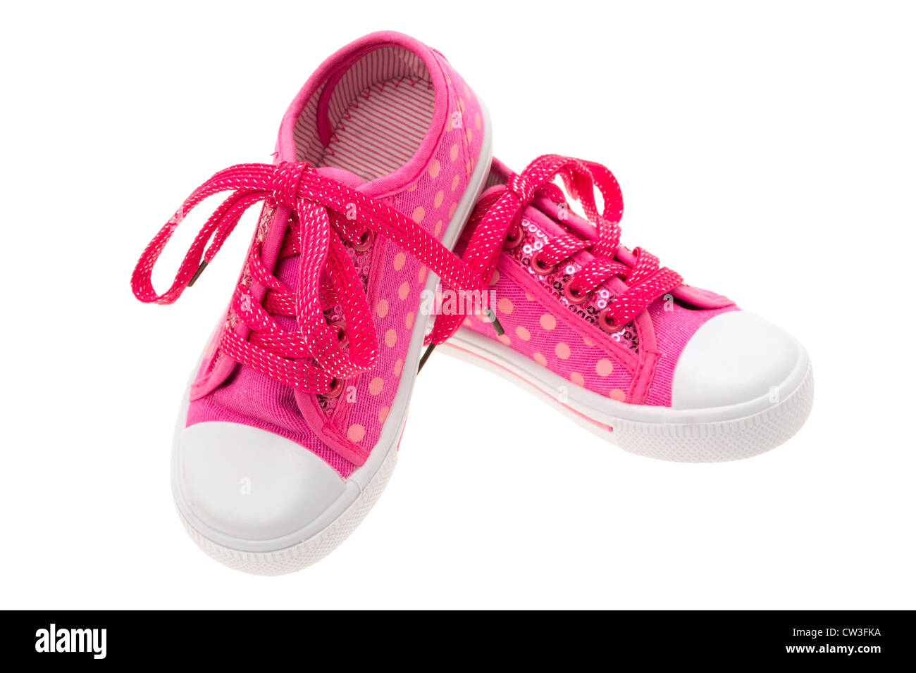 Pink shoes for a little girl - studio shot with a white background ...