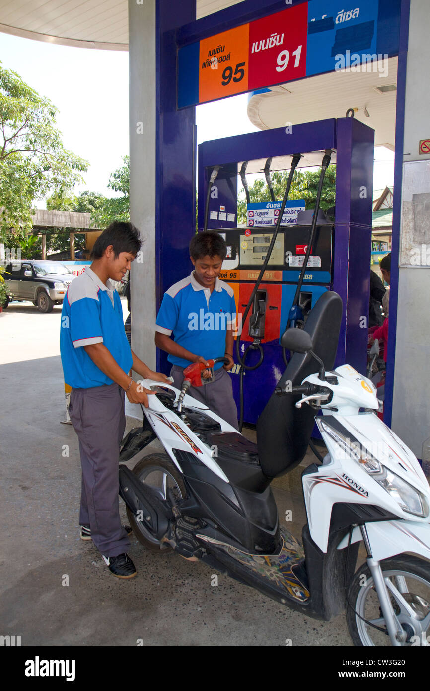 Gas station attendant filling up hires stock photography and images
