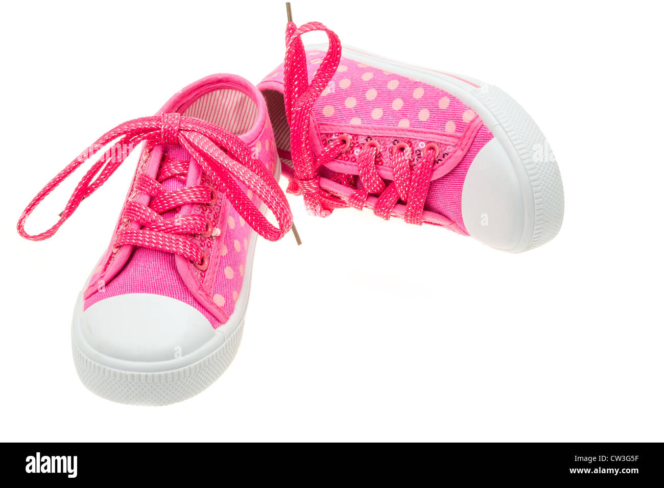Pink shoes for a little girl - studio shot with a white background ...