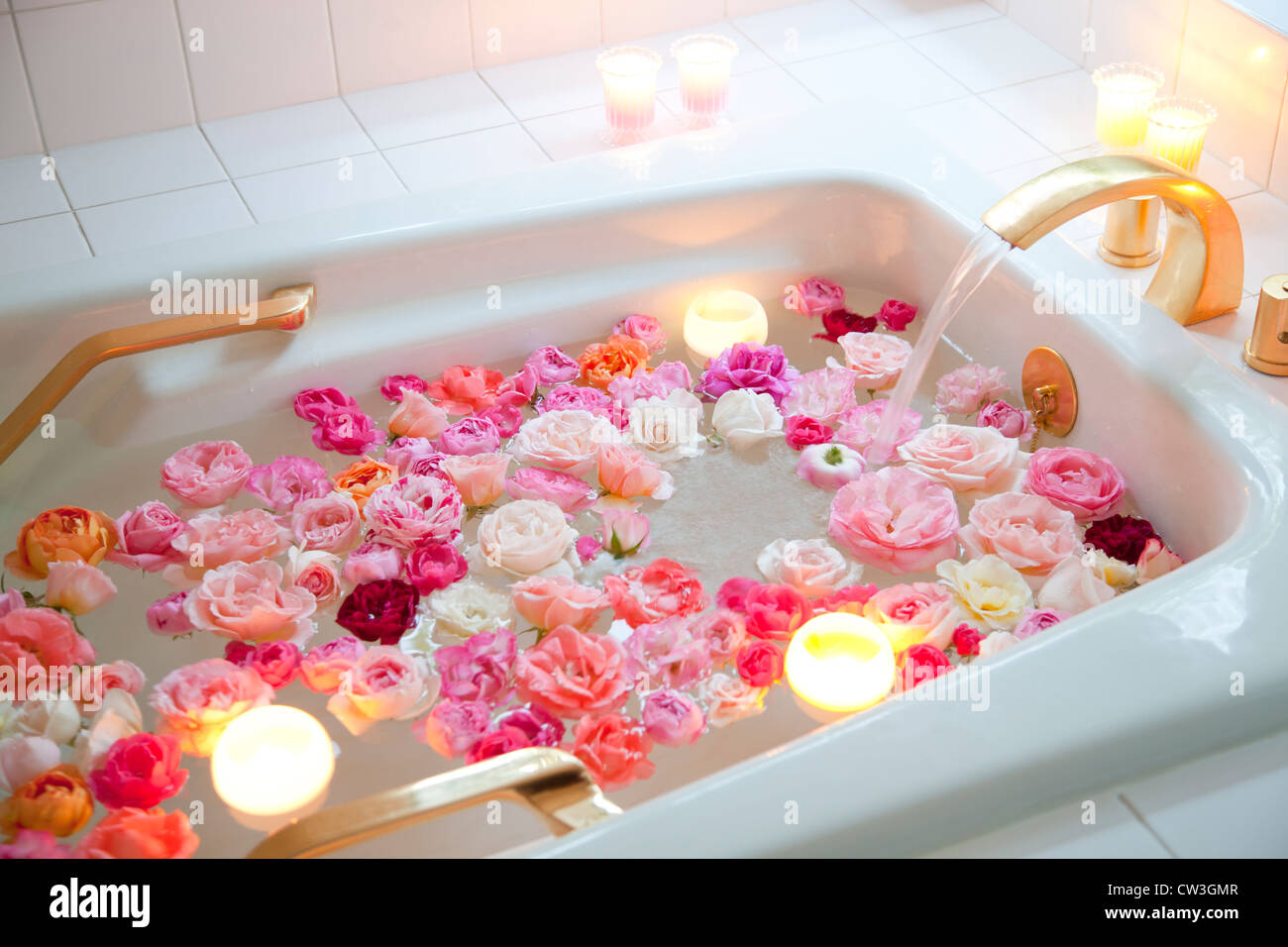Roses floating in bath water Stock Photo