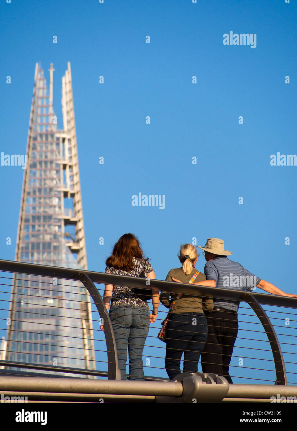 Admiring the Shard from Millennium Bridge, London Stock Photo