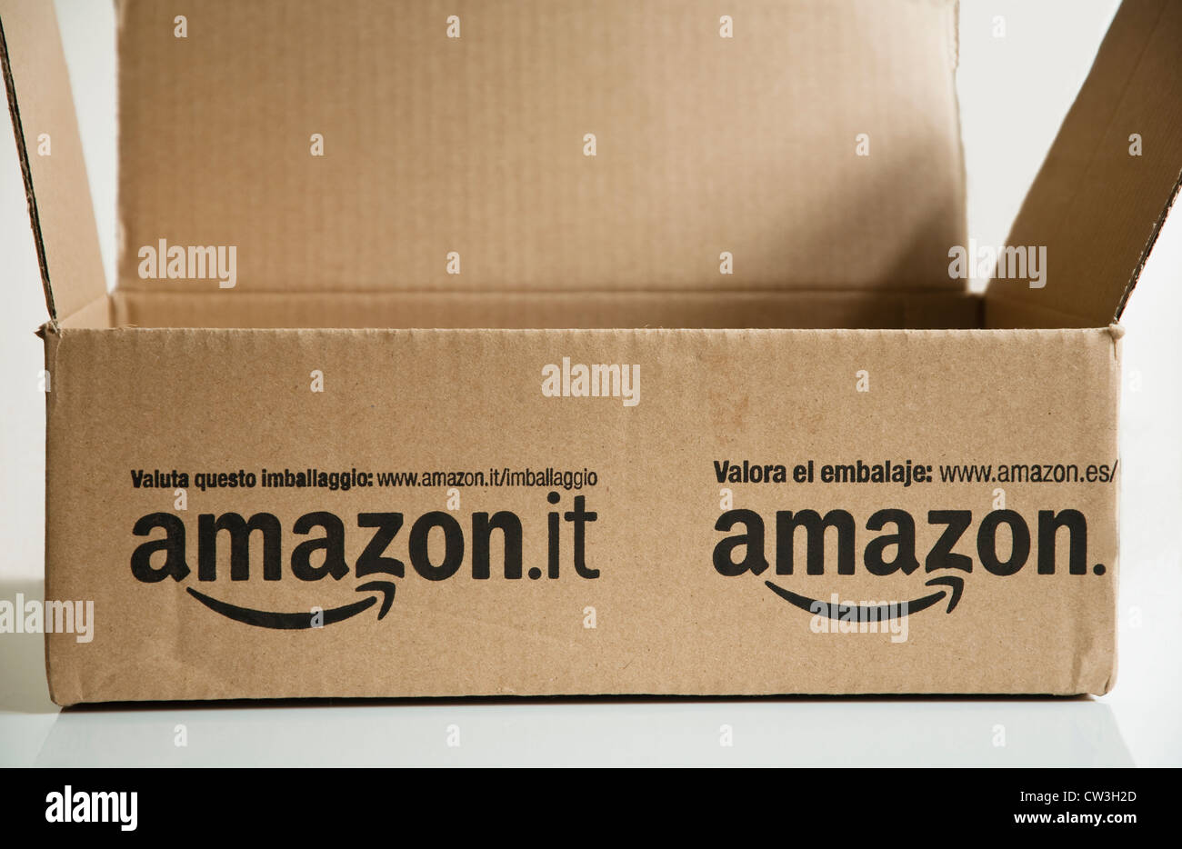 An Amazon Box - from the online company which successfully sends and packages items from warehouse to office or home. Stock Photo