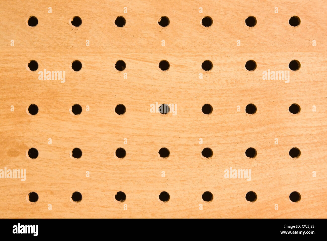 Pegboard holes used for hanging and storing tools Stock Photo Alamy