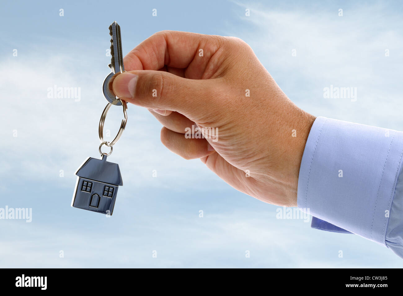 Real estate agent giving house keys Stock Photo Alamy