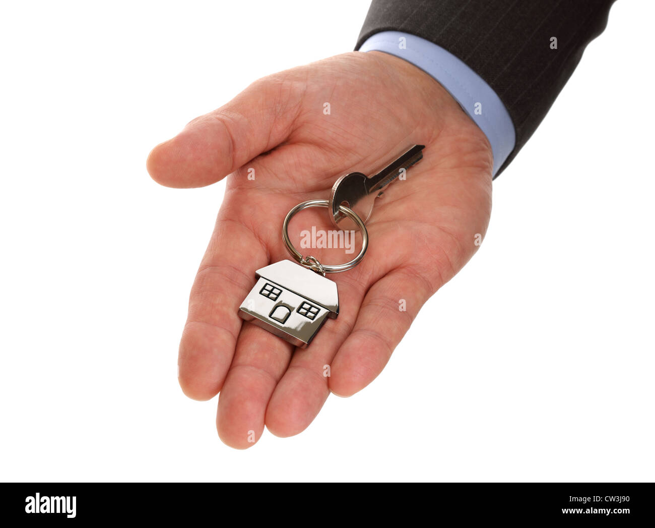 Real estate agent holding house keys Stock Photo
