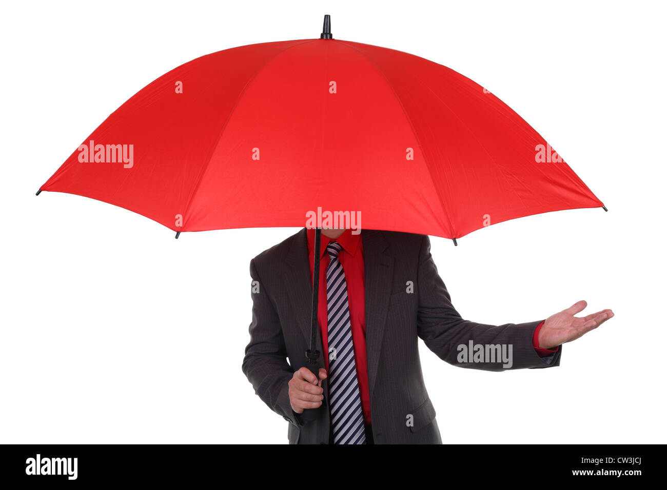 Businessman holding red umbrella Stock Photo