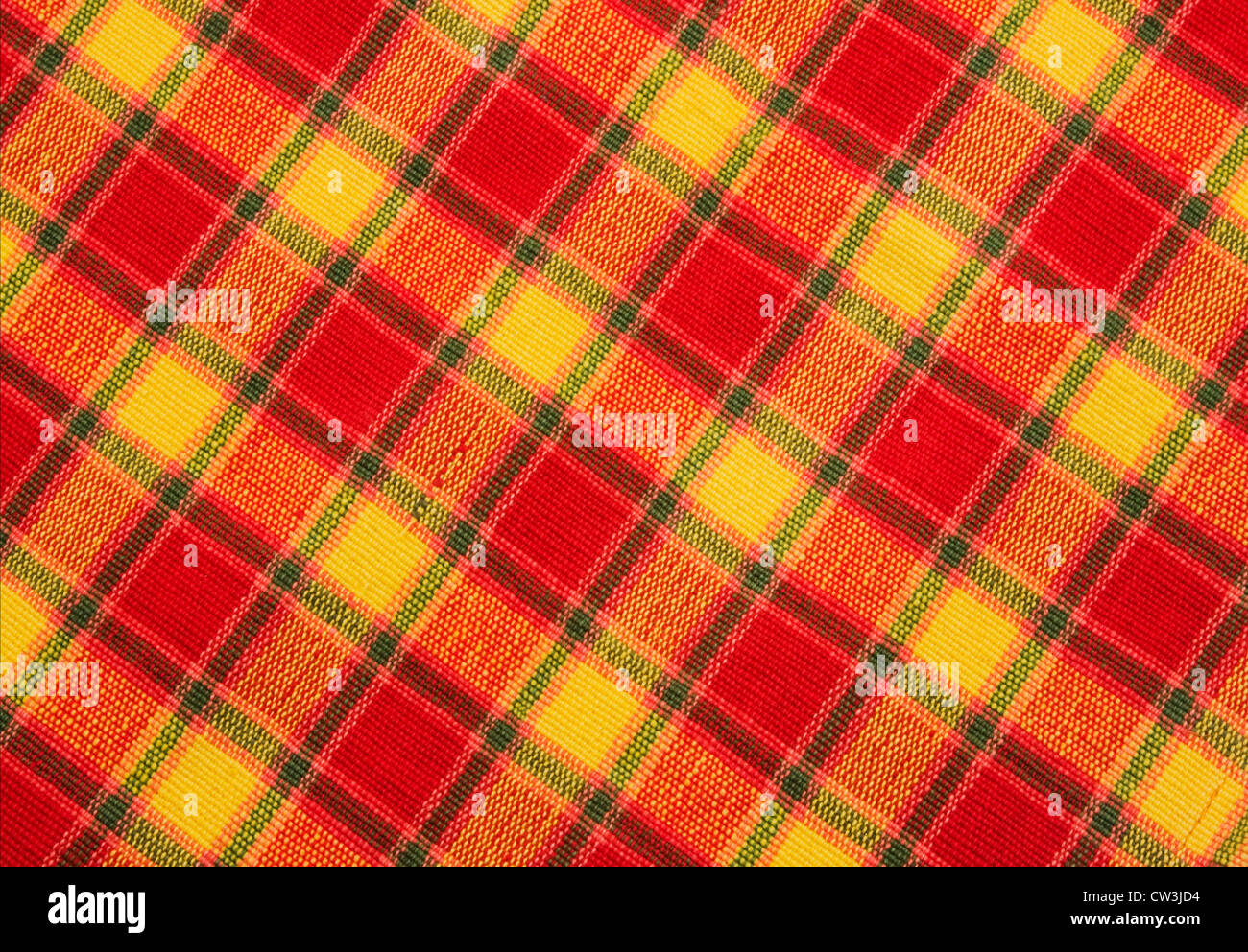 Red yellow and black diagonal plaid textile fabric background Stock