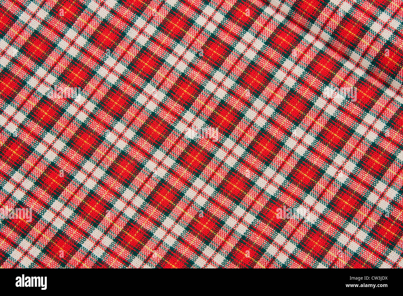 Red white and black diagonal plaid fabric textile background Stock