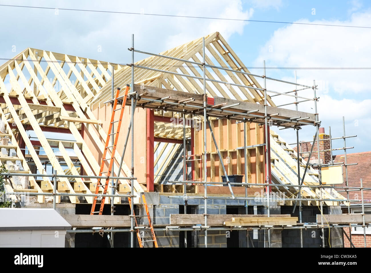 New house under construction with a large dormer roof, Stock Photo