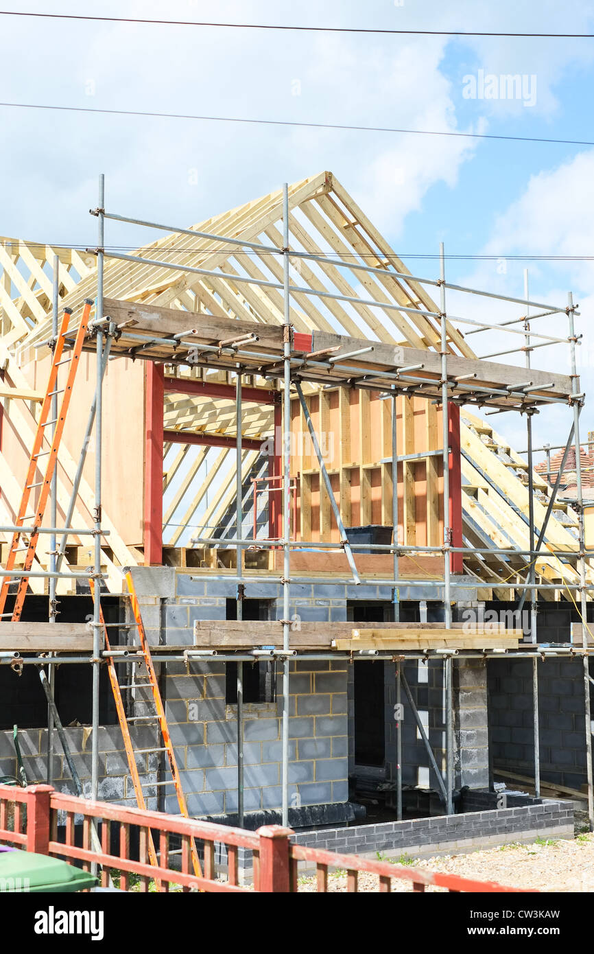 New house under construction with a large dormer roof Stock Photo