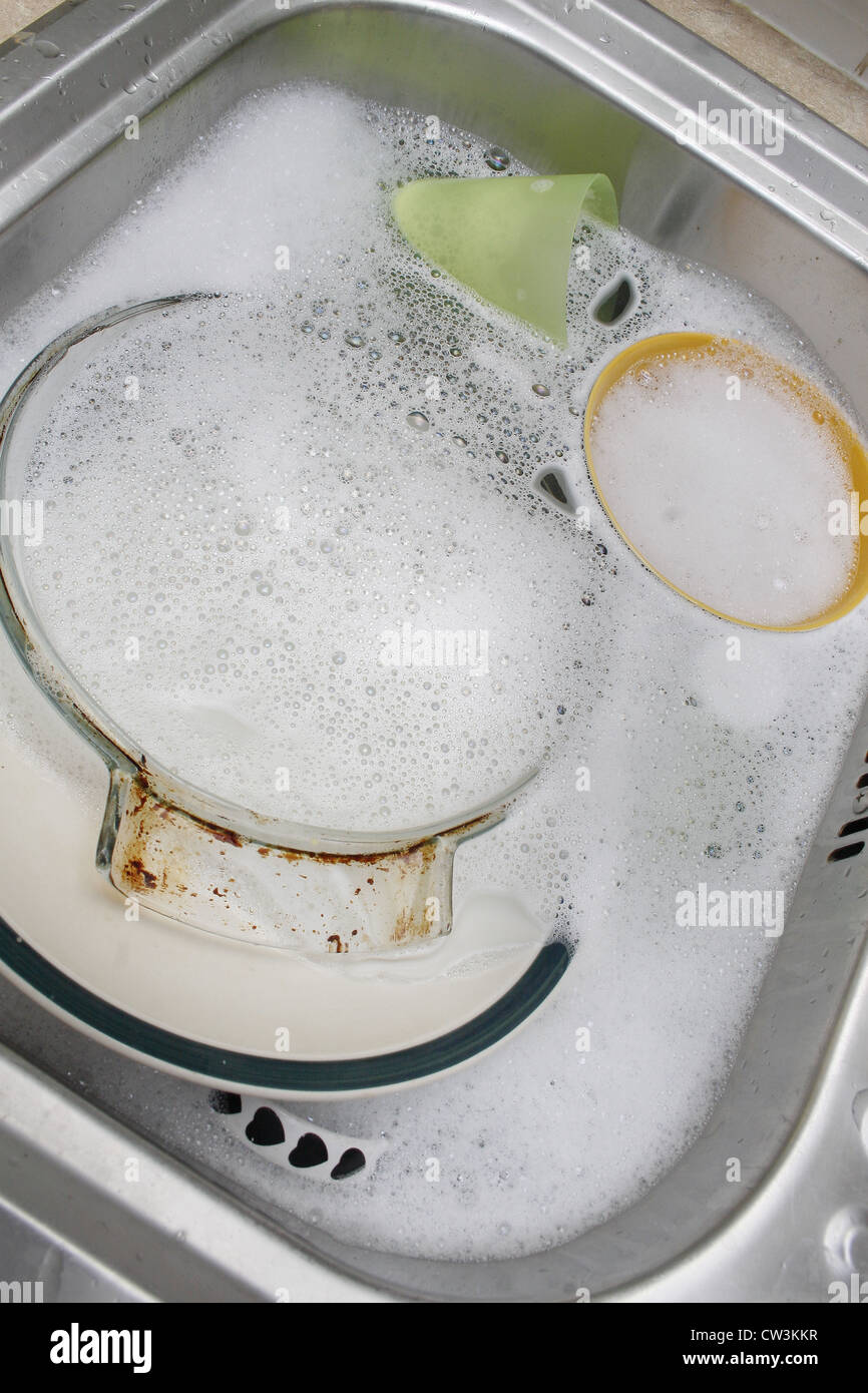 dirty pots in sink waiting to be washed Stock Photo Alamy