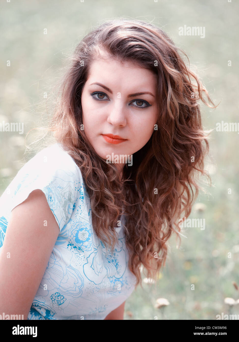 Portrait of a beautiful 20 year old woman enjoying a summer day outdoor. Stock Photo