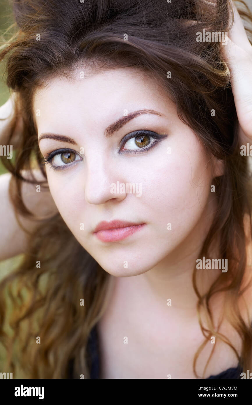Portrait of a beautiful 20 year old woman enjoying a summer day outdoor