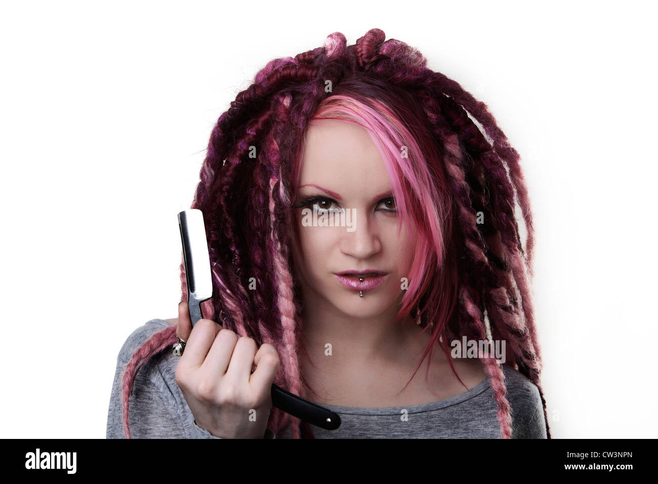 Woman With Dreadlock Hair Holding A Cut Throat Razor What Is She