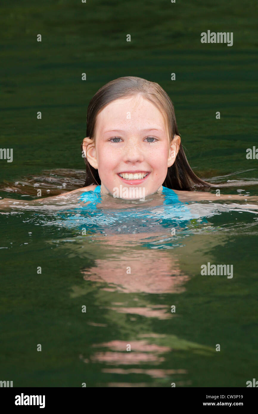 Young girl swimming in Cultus Lake on hot summer dayChilliwack
