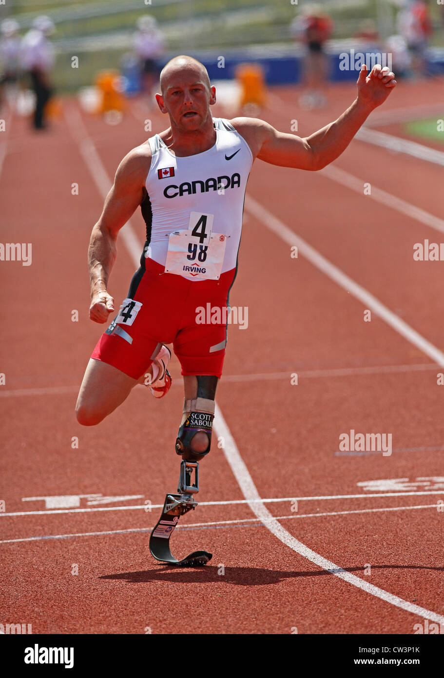 Canadian Paralympic amputee sprinter Earle Connor races at the 2012 NCCWMA & CMA Track & Field Championships. Stock Photo
