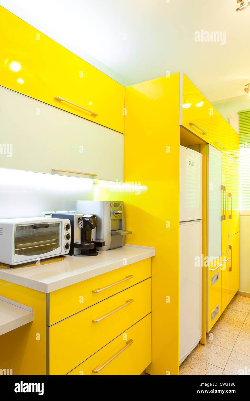 Modern design kitchen with yellow and green elements Stock Photo