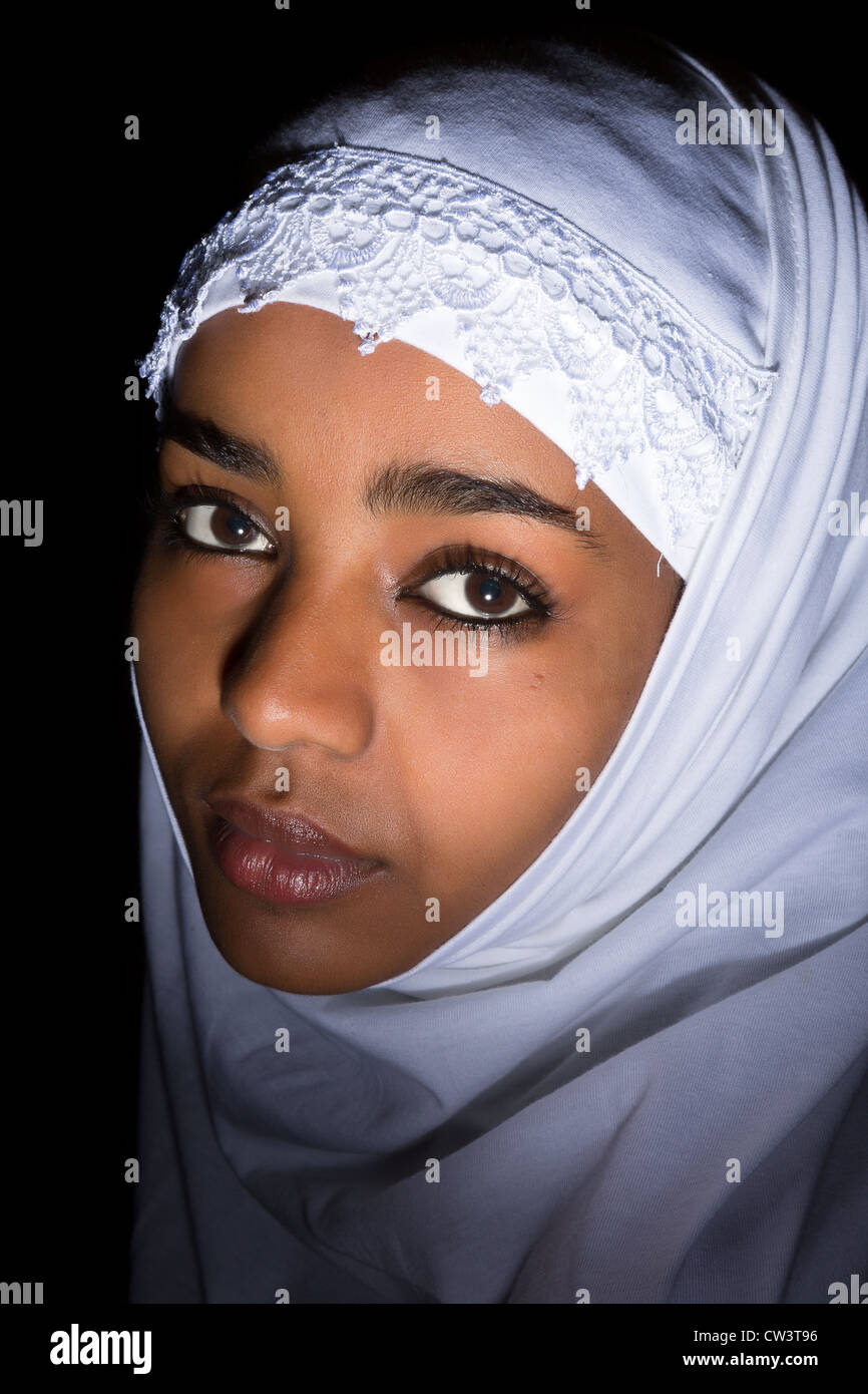 Melancholic Ethiopian girl wearing an islamic white veil Stock Photo