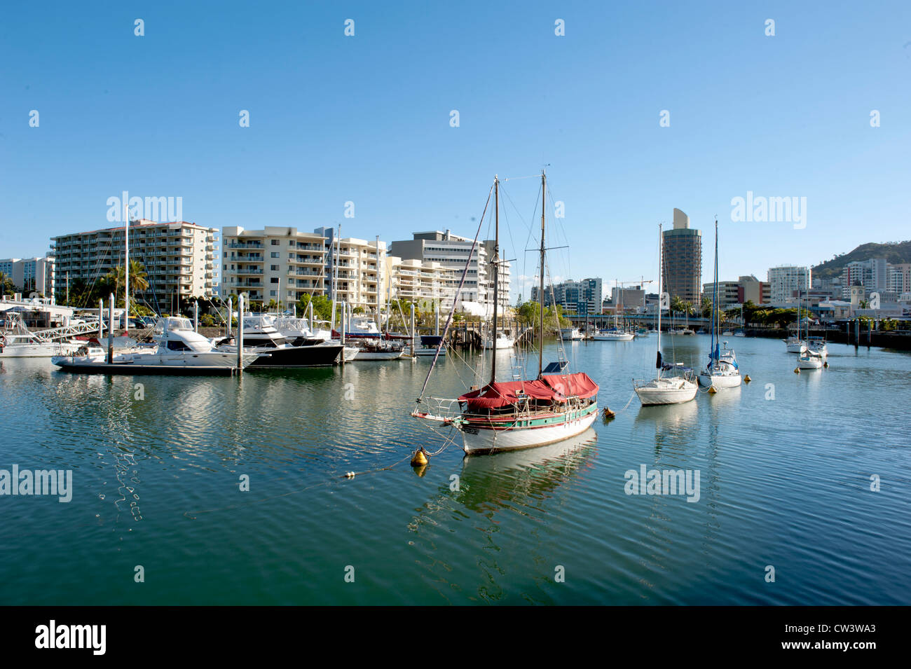 Motor boats, yachts, and sail boats moored in the Ross river, flowing
