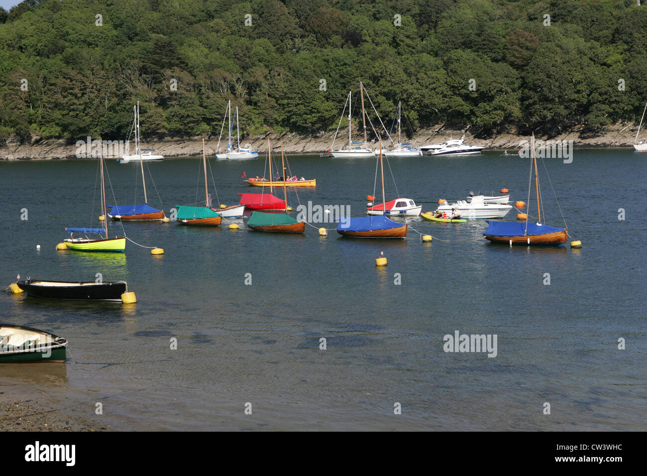 colourfull boats lined up in fowey harbour, cornwall Stock Photo