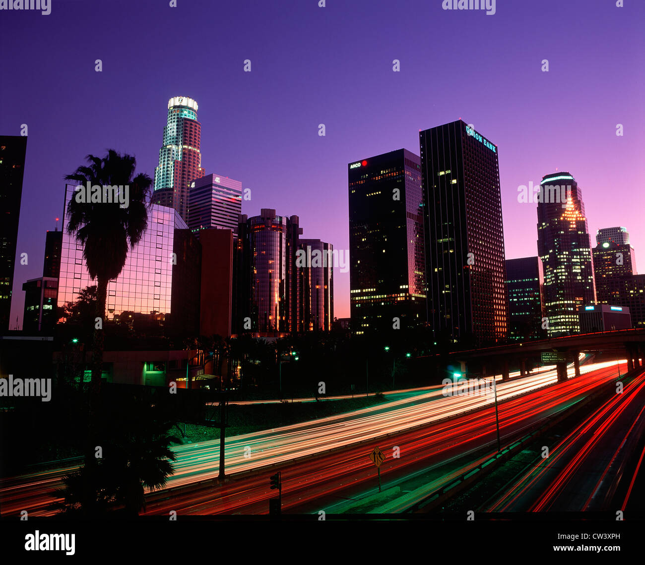 Abstract of the Harbor Freeway with Los Angeles skyline at night, California Stock Photo
