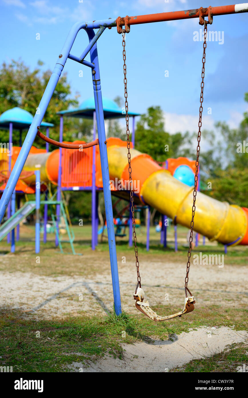 The broken swing is at playground. Stock Photo