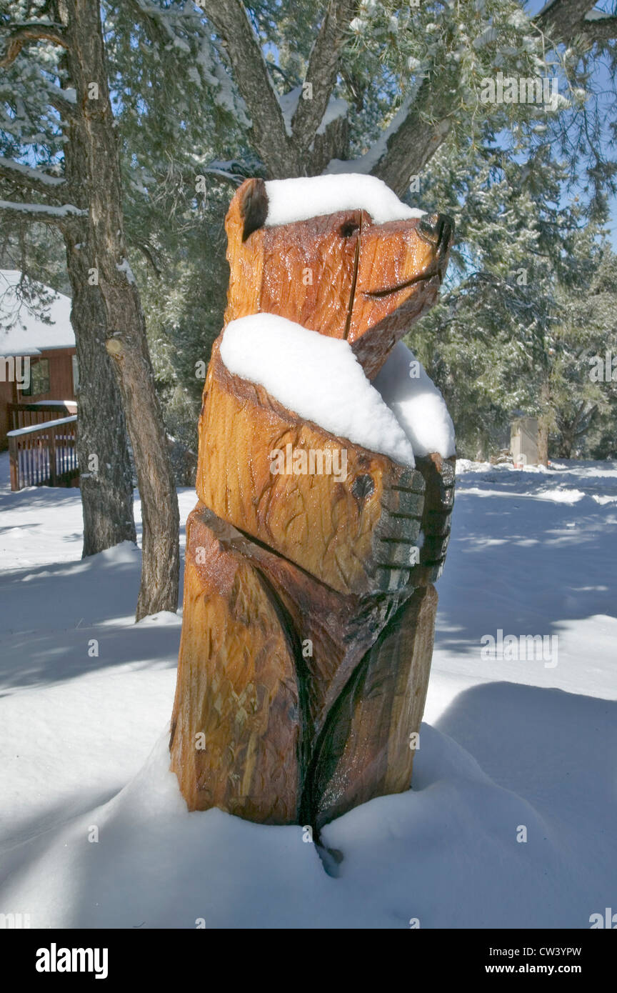 Snow on wooden Bear in Pine Mountain Club, Kern County, Southern California Stock Photo