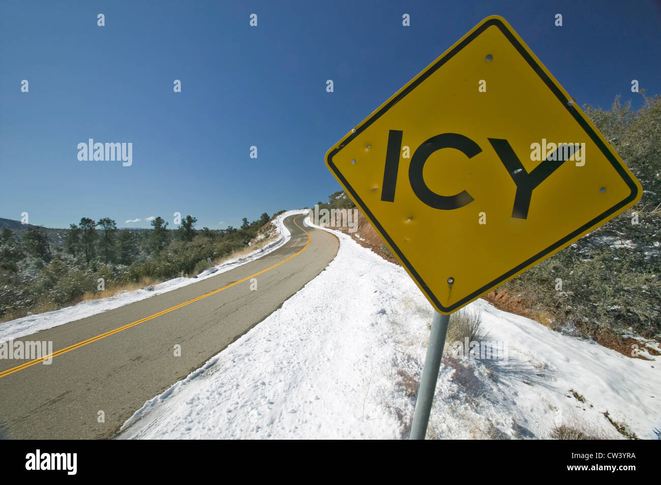 Icy Rocks Sign Icy Road sign after fresh snow near Pine Mountain Club, Kern County ...