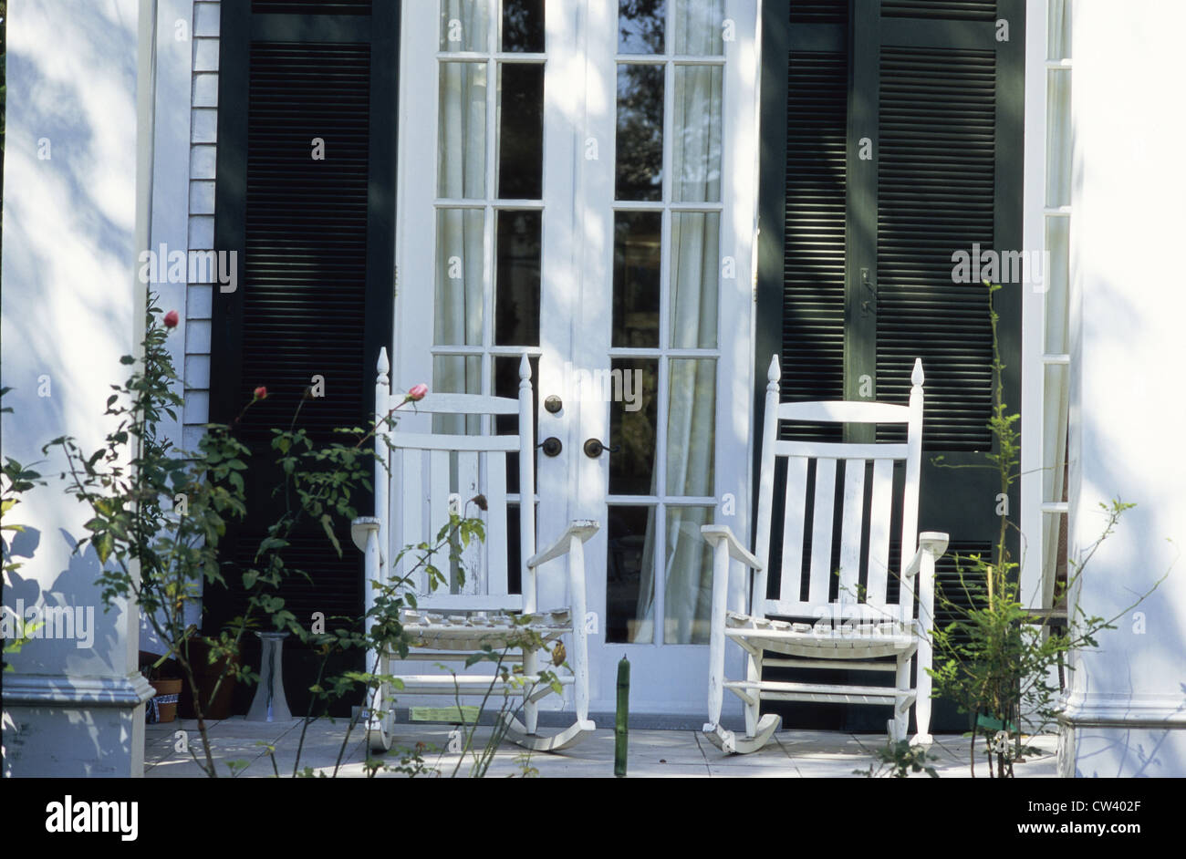 Two rocking chairs on a front porch Stock Photo Alamy