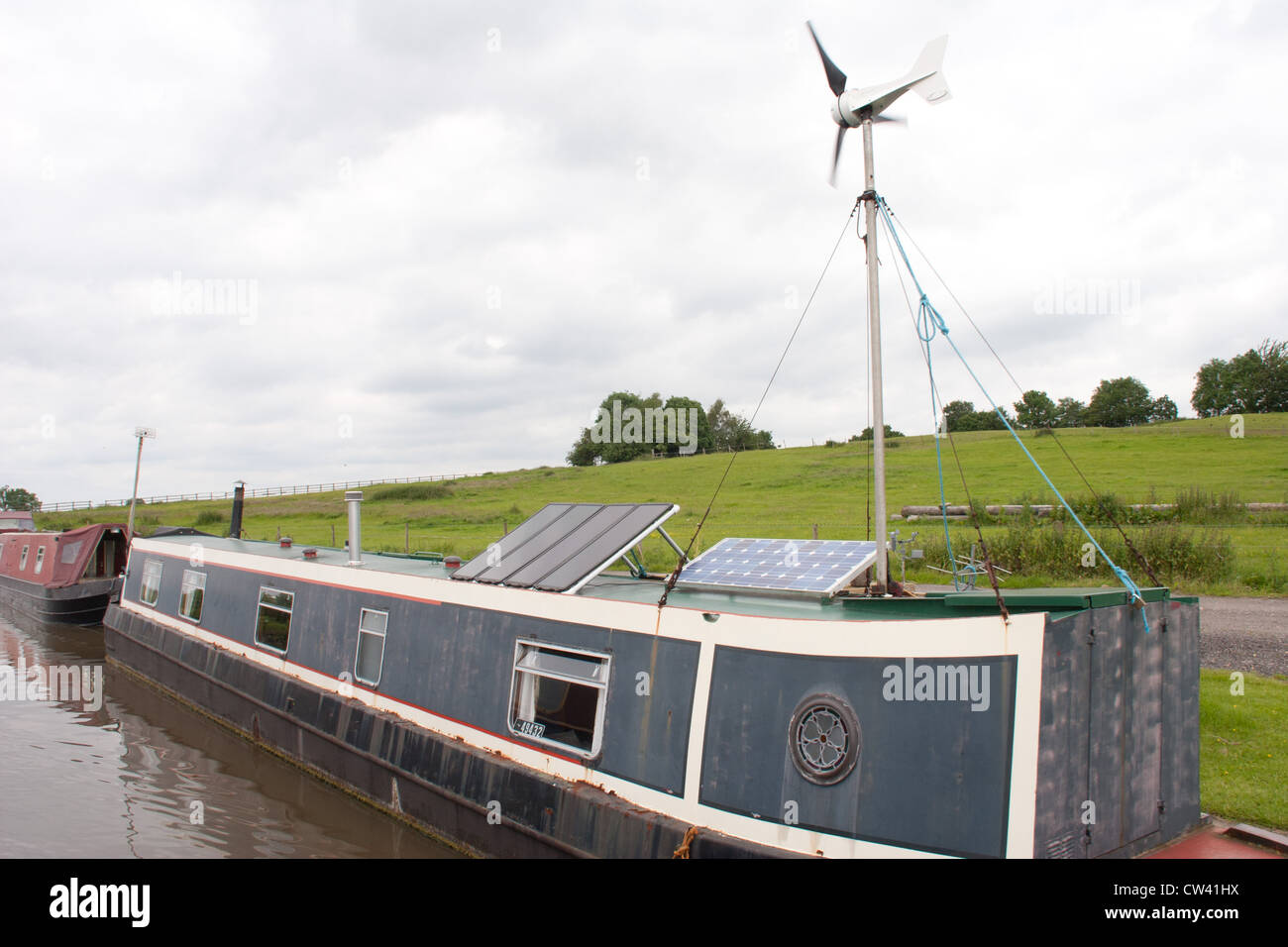 Energy saving, solar power, wind power, electricity generator, on a narrow boat , Oxford canal, Warwickshire. Stock Photo