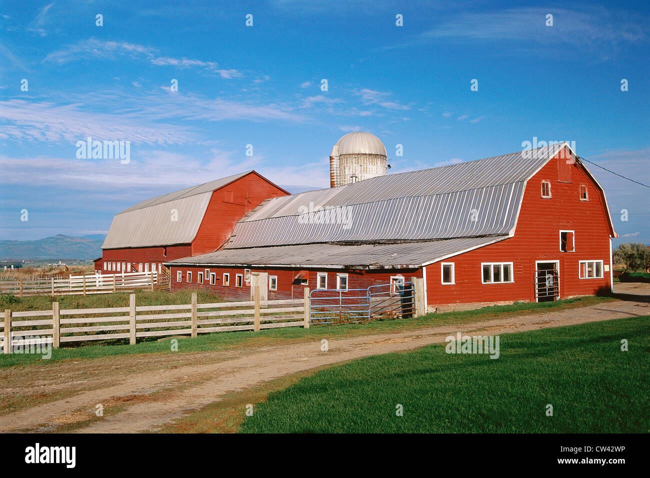 Red barn with silo beyond Stock Photo