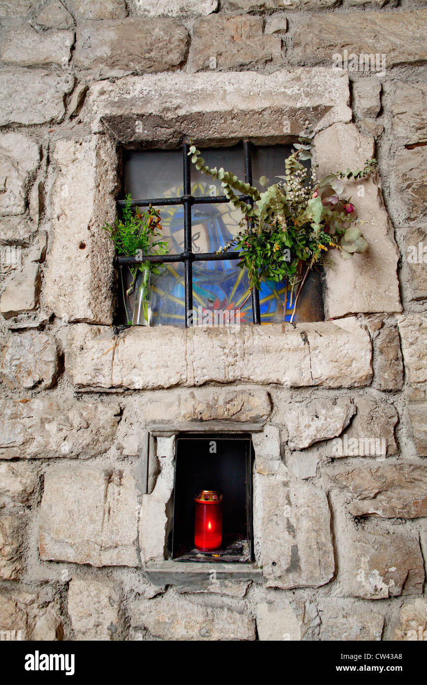 Small catholic altar / shrine in narrow alley in Old Town of Split, Croatia Stock Photo