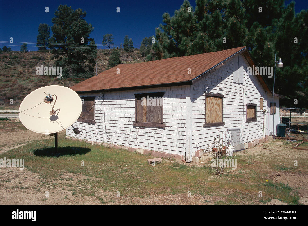 Cottage with satellite dish in yard Stock Photo Alamy