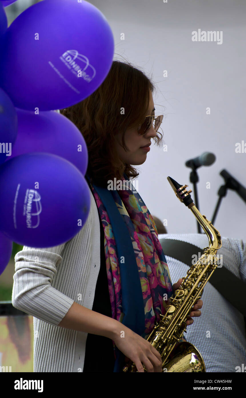 Female sax player performing with the Freddie King Band on the opening