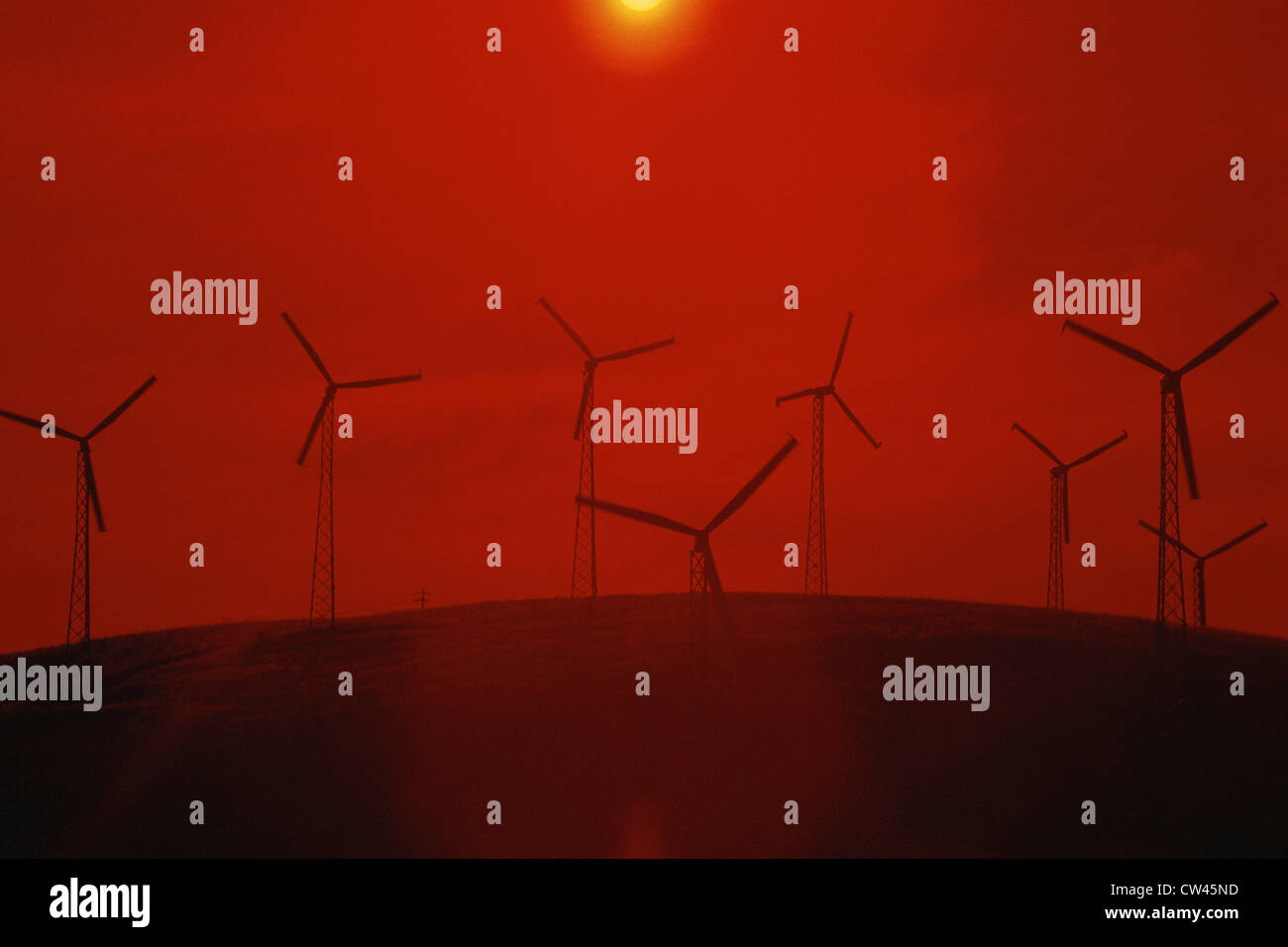 Wind farm against red sunset Stock Photo Alamy