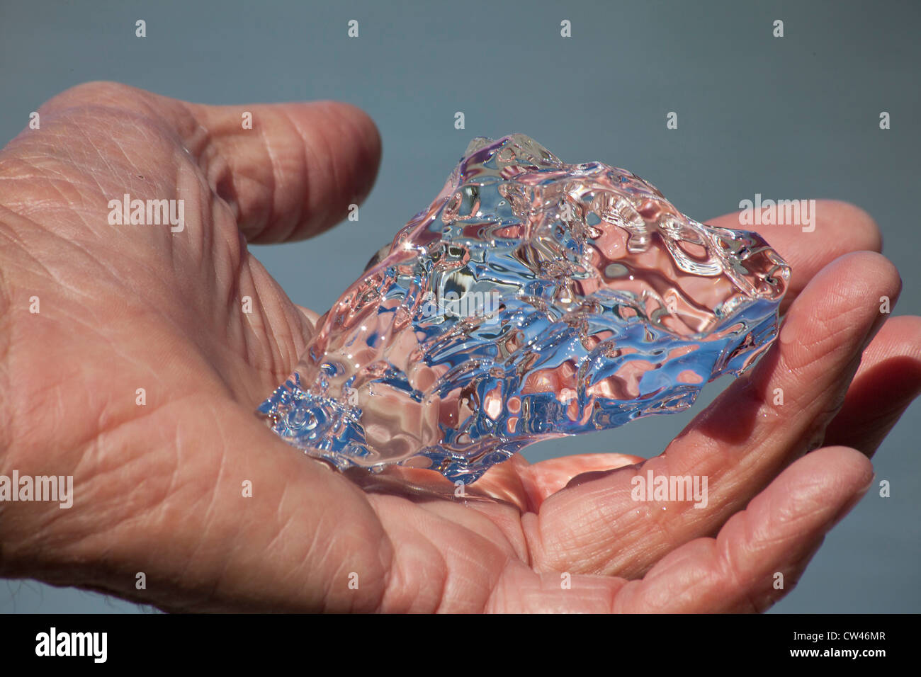 Mans hand holding thin ice hi-res stock photography and images - Alamy