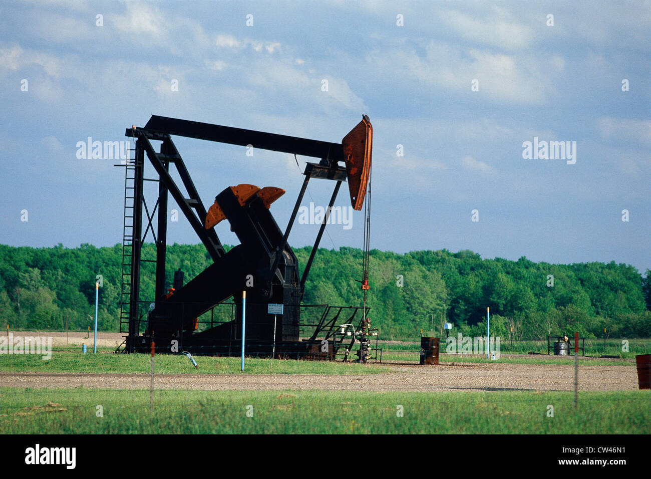 Pump jack at oil well Stock Photo Alamy