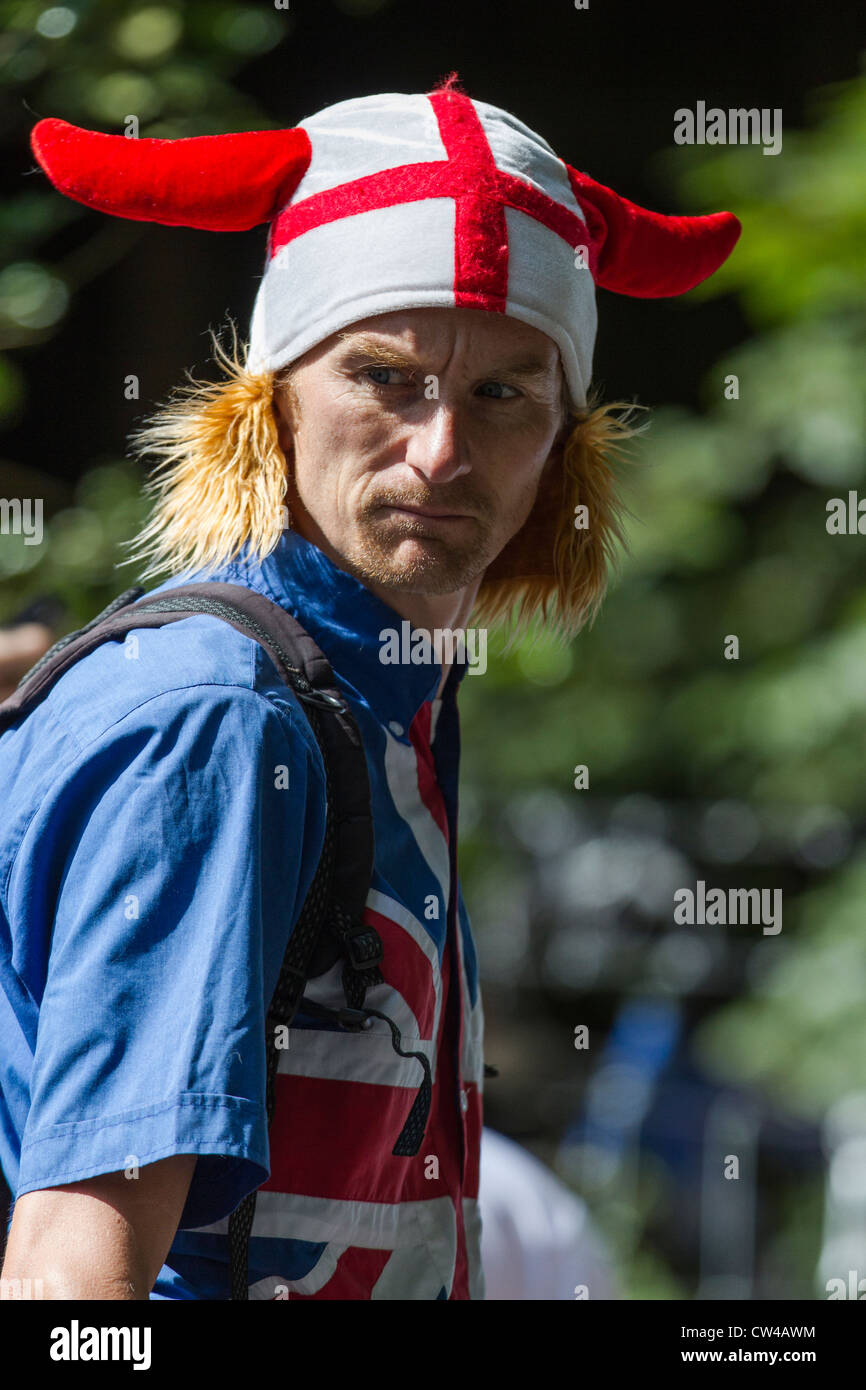 Man wearing a hat with horns and cross of St George together with a union flag shirt Stock Photo