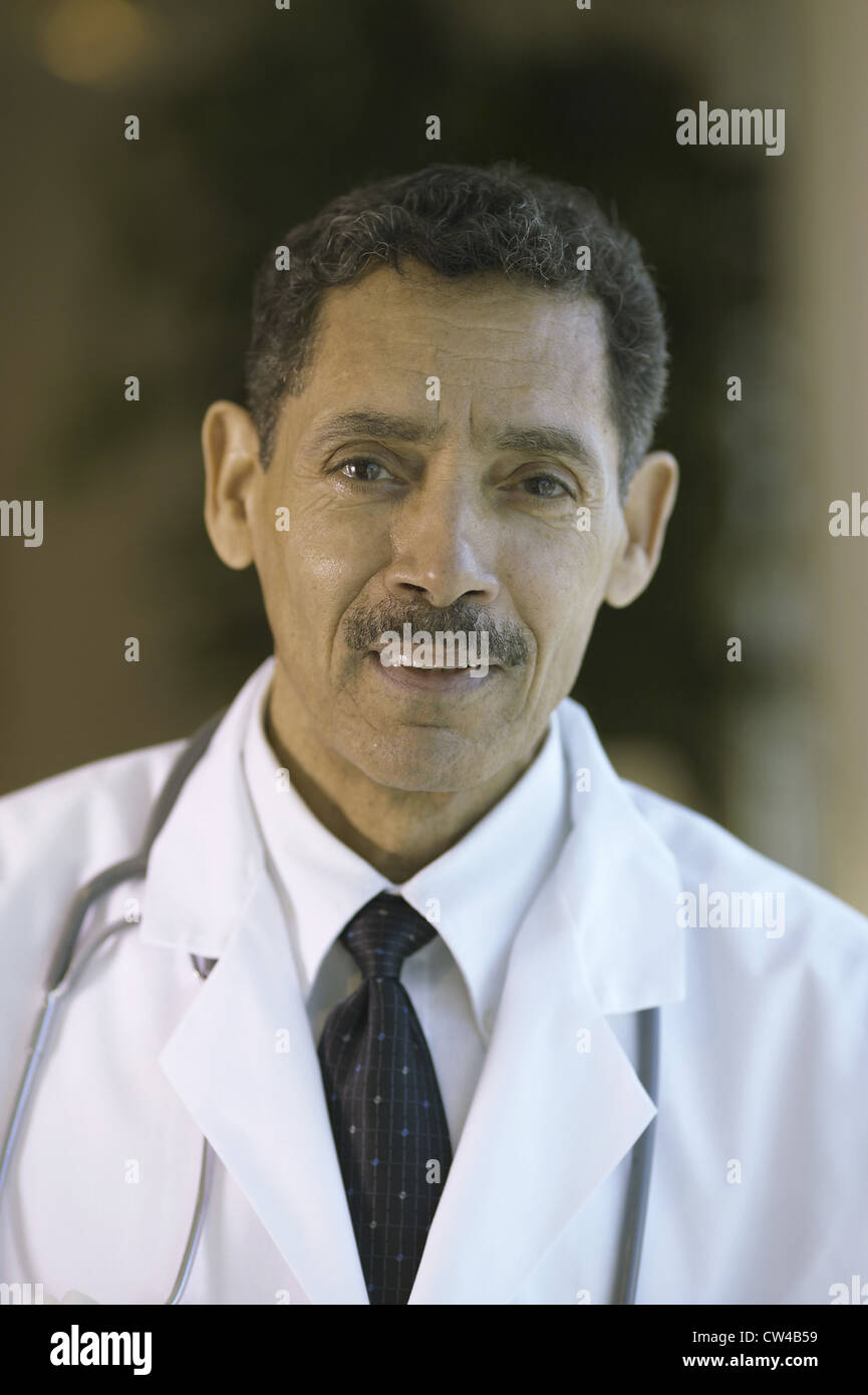 Portrait of a male doctor smiling Stock Photo - Alamy